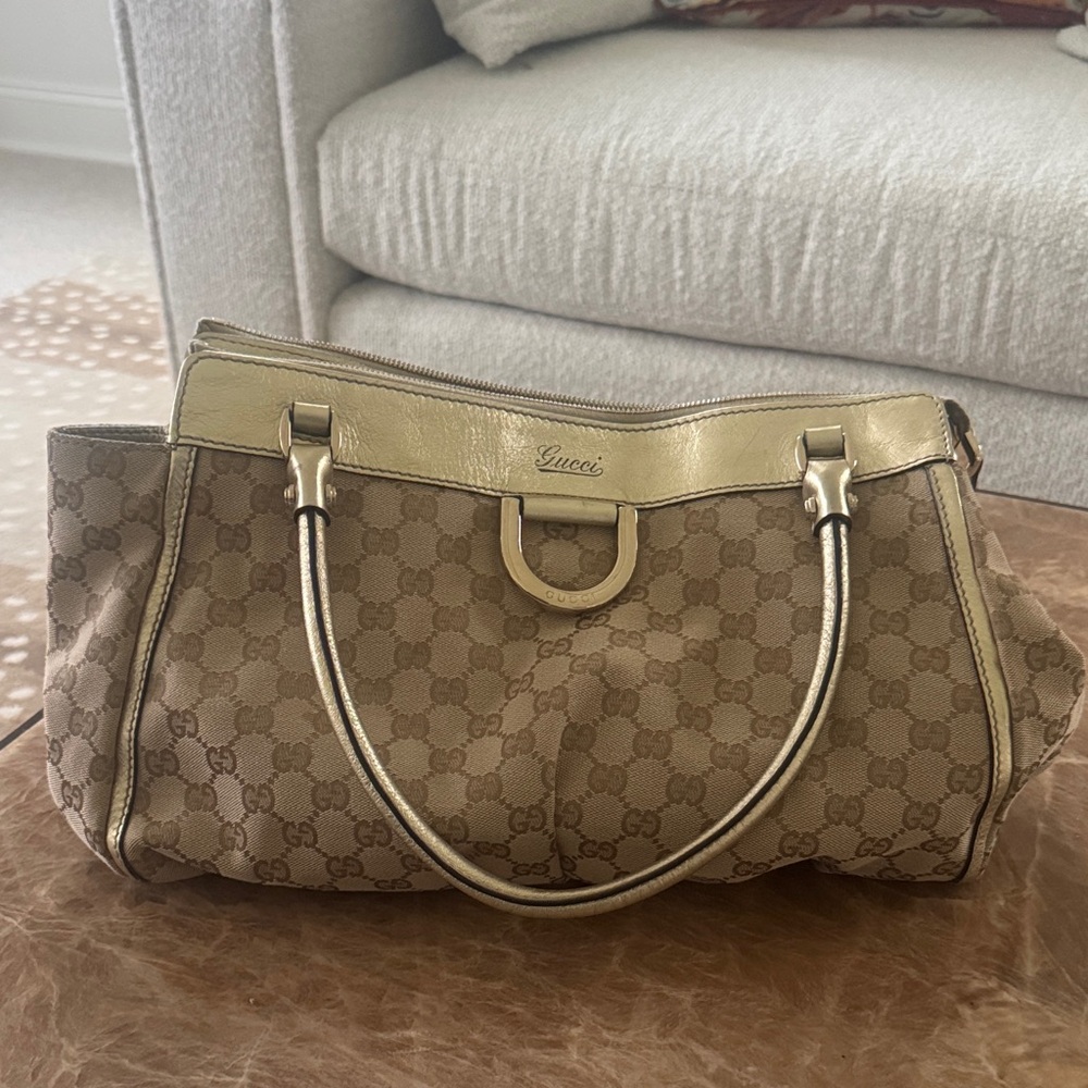 Authentic Gucci handbag with gold leather and hardware
